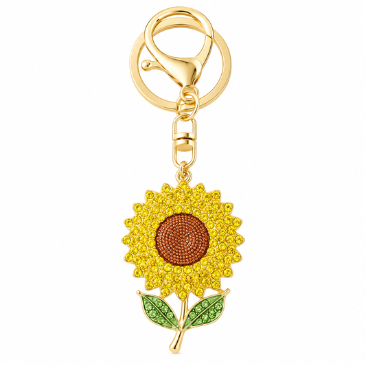 A rhinestone sunflower keychain featuring yellow and brown crystals on a gold-tone clasp and ring.